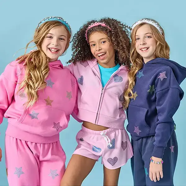 Three tween girls wearing Iscream clothing Three tween girls wearing Iscream clothing